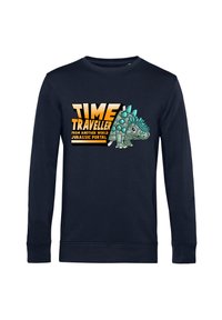 Felpa a maniche lunghe blu navy con una grafica che rappresenta un dinosauro e il testo: "VIAGGIATORE NEL TEMPO DA UN ALTRO MONDO PORTALE GIURASSICO."