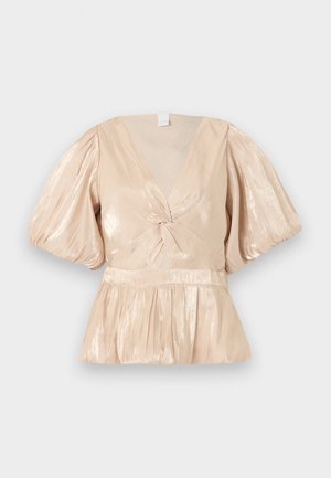 Λαμπερό μπεζ μπλουζάκι με βαθύ V λαιμόκοψη, φουσκωτά κοντά μανίκια, στριφτός κόμπος μπροστά και φουσκωτή μέση με πτυχώσεις.