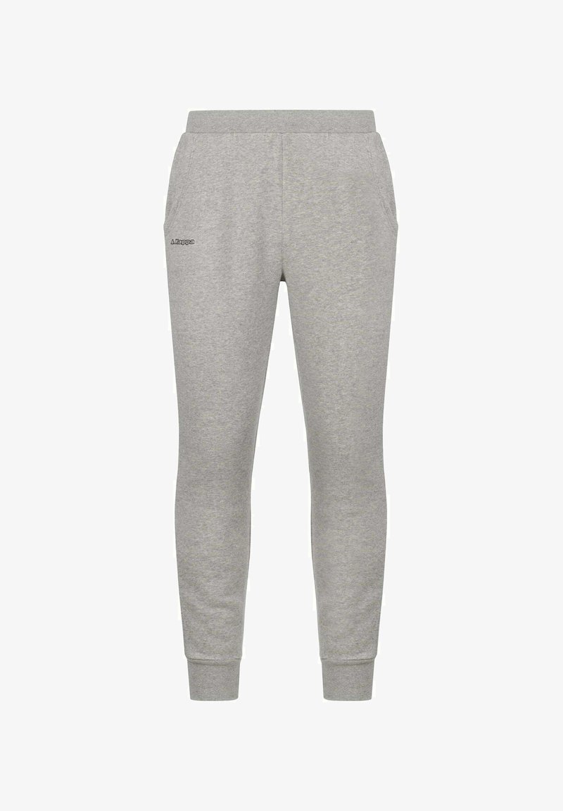 Pantaloni della tuta grigi in tessuto morbido, con design a gamba affusolata, vita elastica, tasche laterali e un piccolo logo nero sulla coscia sinistra.