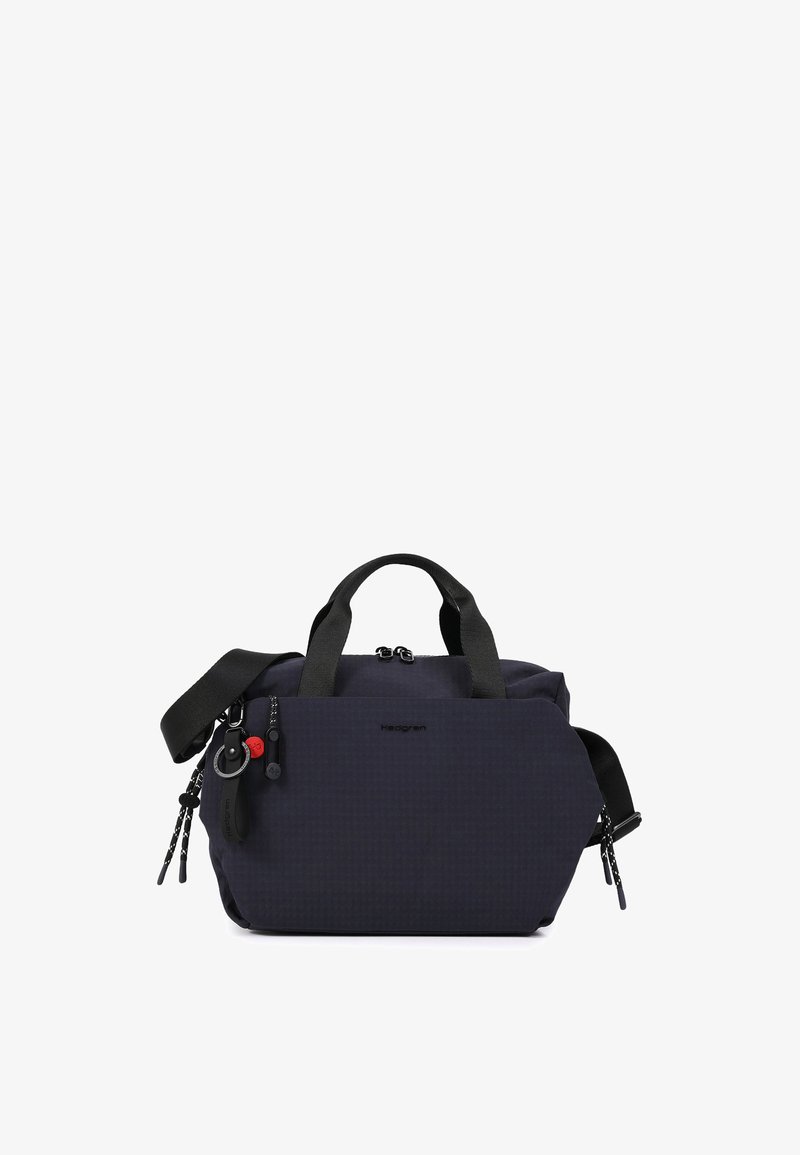 Sac à main compact bleu marine foncé avec double poignées, bandoulière réglable, poches avant zippées et un porte-clés attaché à la tirette du zip.