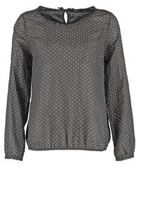 Blusa a maniche lunghe grigia scura con pois bianchi, orlo arricciato e apertura a forma di chiave sulla schiena. Realizzata in materiale leggero e semitrasparente.