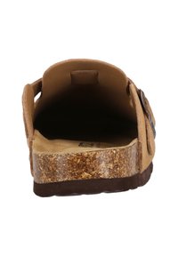 Brown suede slide sandal with a cork midsole, soft footbed, and a buckle accent. The interior is smooth and unlined.