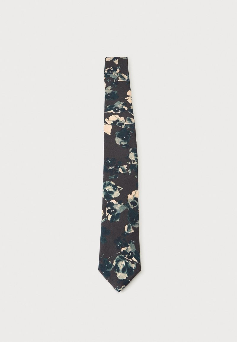 Σκούρα γραβάτα με floral μοτίβο σε αποχρώσεις του τυρκουάζ, του ναυτικού μπλε και του μπεζ, παρουσιάζεται επίπεδη σε ανοιχτό γκρι φόντο.