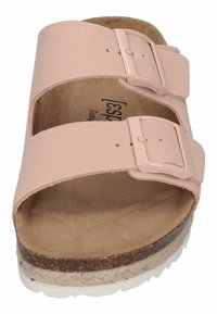 Pink suede sandals featuring two adjustable straps with buckles, a cushioned footbed, and a textured espadrille-style sole.