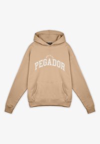 Sudadera beige con un gran logotipo blanco "PEGADOR" en el pecho, bolsillo canguro delantero y capucha con cordón. Tejido suave de mezcla de algodón.