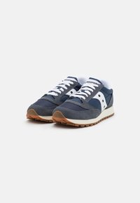 Blue sneaker with mesh and suede materials, white laces, and a gum outsole. Features the Saucony logo on the side and padded collar.
