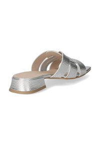 Silver metallic slide sandals with a textured finish, featuring three wide straps and a short, block heel with a tan sole.