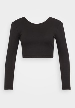 Mustavöinen ribattu pitkähihainen crop-top, jossa on pyöreä pääntie ja tiukka muotoilu, pehmeä rakenne eikä näkyvää metalliosaa.