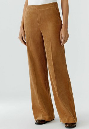 Bruine corduroy wijde broek met verticale ribbels, hoge taille en zijzakken, met een zachte textuur en een comfortabele pasvorm.