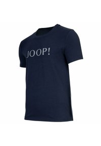 Camiseta de algodón azul marino con mangas cortas y cuello redondo, con la palabra "JOOP!" impresa en gris en la parte frontal.