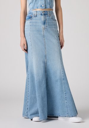 Jasnoniebieska spódnica maxi z denimu z wysokim stanem, w kroju A-line i z rozcięciem z przodu. Charakteryzuje się tradycyjnym przeszyciem dżinsowym oraz pięcioma kieszeniami.