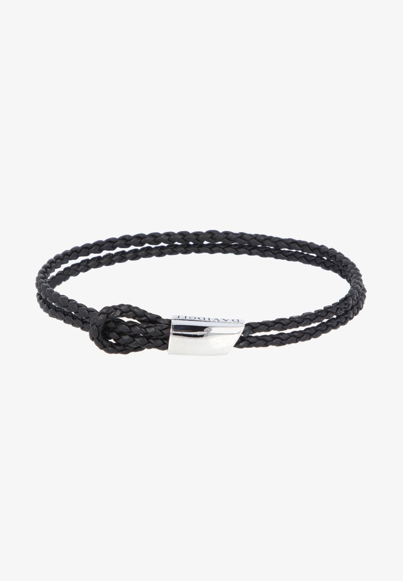 Black braided leather bracelet with a silver clasp. Features a simple knot design and smooth texture. Sleek and minimalistic appearance.