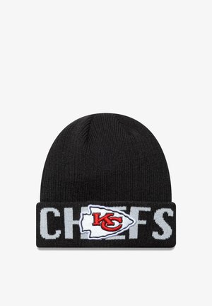 Black knit beanie featuring a folded cuff. "CHIEFS" is prominently displayed in white, with a red and white logo on the cuff.
