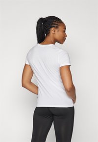 Puma SUMMER SPORTS TEE - Apdrukāts T-krekls - white