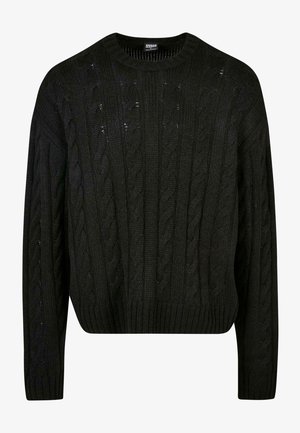 Suéter negro de punto con patrones de trenzado, cuello redondo, hombros caídos y dobladillo acanalado. Diseño midi-crop con un acabado texturizado.