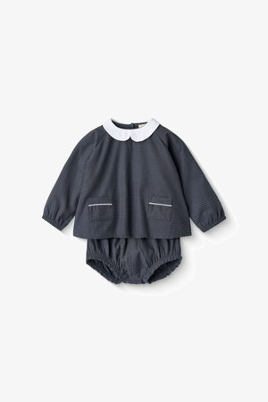 Cotton two-piece set featuring a dark gray checkered pattern, white collar, long sleeves, two front pockets, and gathered bloomer shorts.