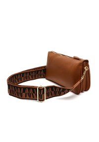 Brown leather shoulder bag with a textured finish and gold zipper, featuring a patterned black and brown adjustable strap.