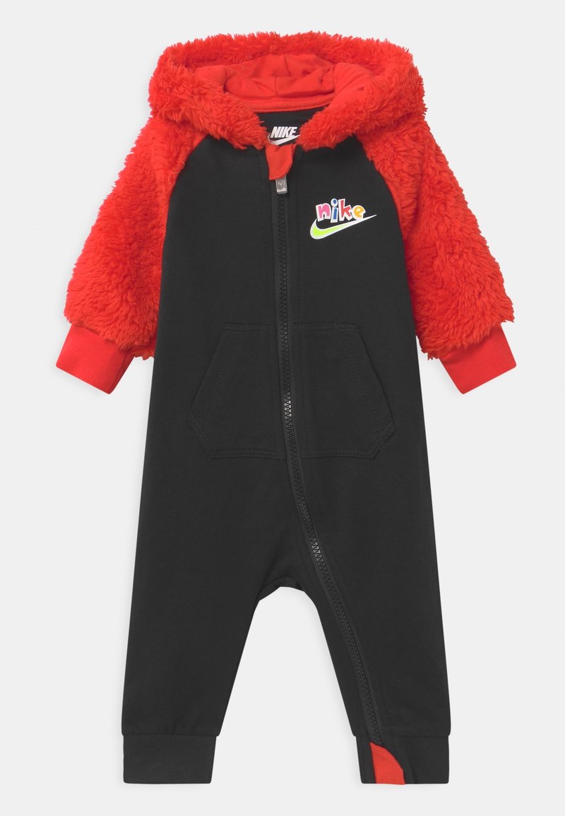 Black one-piece jumpsuit with red fur sleeves, zip front, front pocket, and multicolored Nike logo on chest. Red cuff accents.