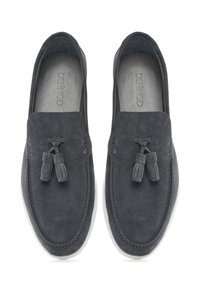 Gray suede loafers with tassel detail, white rubber sole, stitched accents, and rounded toe. Soft texture and minimal design.