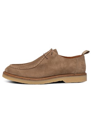 Brown suede shoes with a rounded toe, stitched detailing, and a subtle heel. Features a tan rubber sole and a rear pull tab for easy wear.