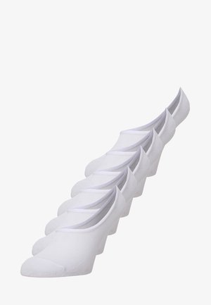 Chaussettes blanches invisibles en tissu texturé avec un design à coupe basse. Comprend un orteil renforcé et un bord élastique pour un ajustement sécurisé.