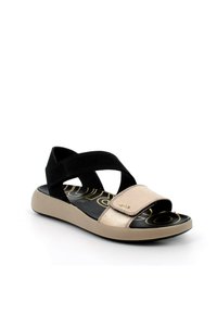 Sandali neri e beige con design a fascia incrociata, caratterizzati da un accento metallico e una soletta testurizzata. Suola piatta per il massimo comfort.