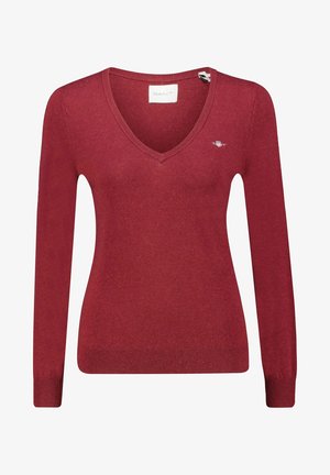 Maglione rosso a maglia con scollo a V e maniche lunghe. Presenta un logo sul petto e polsini e orlo a coste. Texture morbida, design aderente.
