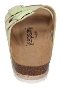 Light green leather sandal with two buckle straps, cork midsole, natural fiber detailing, and a textured insole featuring the brand name.