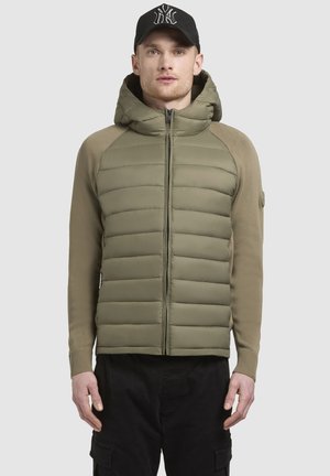 Hooded jacket with a quilted olive green front and beige sleeves, featuring a front zipper and ribbed cuffs.