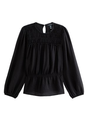 Schwarze Bluse mit langen Ärmeln, gerafftem Einsatz, elastischen Manschetten, tailliertem Schnitt und kleinem Schlitz mit Knopfverschluss am Rückenausschnitt.