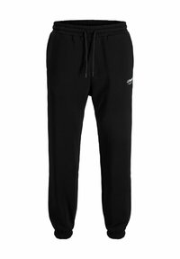 Svarta sweatpants gjorda av mjukt tyg, med ett elastiskt midjeband med dragsko, ribbade manschetter och en liten vit tryckt logodetalj.