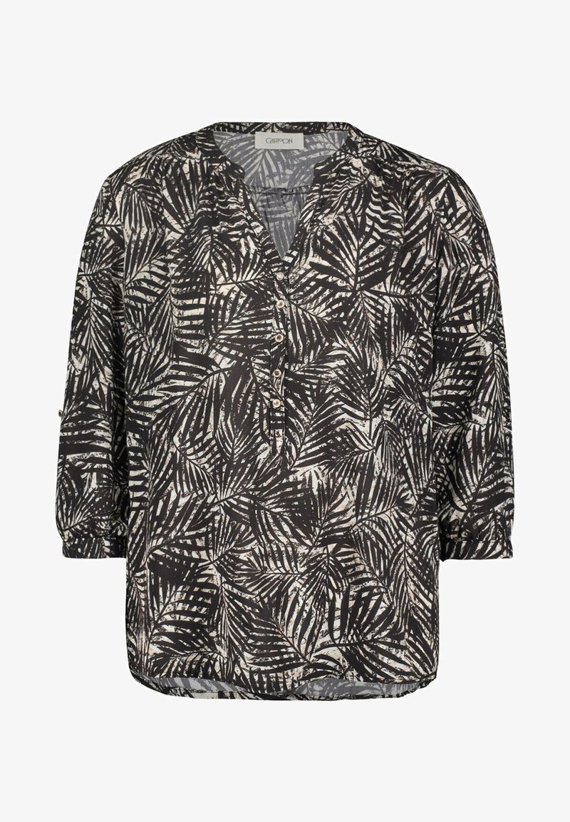 Black and beige blouse featuring a leaf print, loose fit, v-neckline, and three-quarter sleeves with button details. Lightweight, textured fabric.