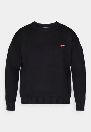 Black knitted sweater with a round neckline, ribbed cuffs, and hem, featuring a small red logo on the front. Cozy and casual design.