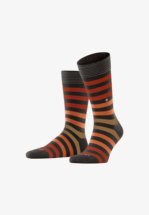 Chaussettes rayées avec un mélange de marron foncé, rouille, orange et vert olive. Poignet côtelé en haut avec un petit logo sur le côté.