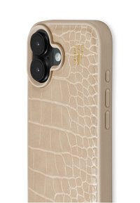 Beige crocodile-patterned phone case with raised textured design, black dual-camera cutout, side buttons, and embossed logo detail.