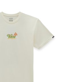 Camiseta de algodón color crema con cuello redondo. Presenta un logo colorido de "Vans Off The Wall" en verde y naranja en la parte frontal.