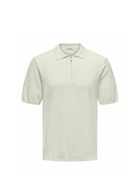Polo a maniche corte in bianco sporco con collo zip, realizzato in tessuto morbido, con colletto classico e orlo a coste.