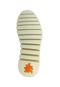 Shoe outsole, off-white color, textured rubber with horizontal ridges, featuring an orange star logo at the heel.