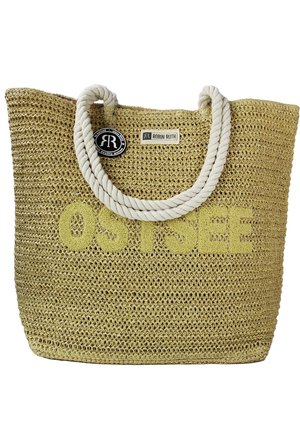Woven straw bag in beige with a textured surface. Features a cream-colored rope handle and "OSTSEE" text in light yellow.