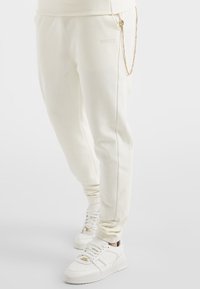 SIKSILK Teplákové kalhoty - off-white