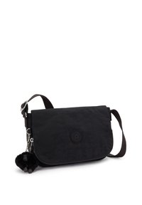 Borsa a tracolla nera con tracolla regolabile e un piccolo portachiavi a forma di scimmietta di peluche attaccato, su uno sfondo bianco.