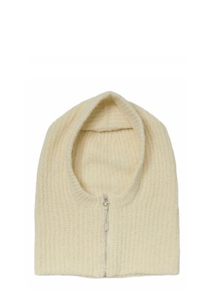 Capuche tricotée de couleur crème avec une fermeture éclair à l'avant, conçue pour couvrir la tête et le cou afin de garder la chaleur.
