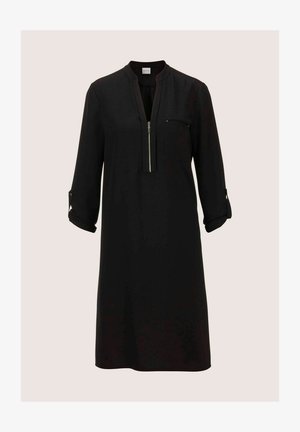 Zwart shirtjurk gemaakt van een gladde stof, met een ritsopening, een borstzak en omgeslagen mouwen met knoopaccenten.