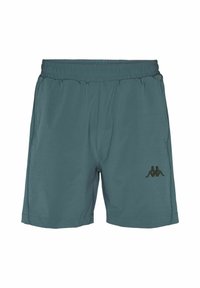 Shorts de sport turquoise avec une ceinture élastique, deux poches latérales et un logo Kappa noir sur la jambe gauche. Tissu lisse et léger.