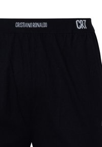 Boxer neri con fascia elastica in vita con "Cristiano Ronaldo" e "CR7" stampati in bianco.