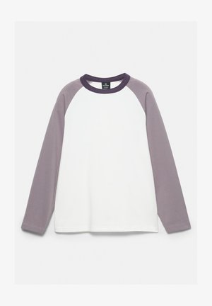 Long-sleeve raglan shirt with white body, light purple sleeves, and dark purple collar, displayed flat on a white background.