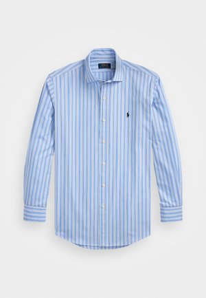 Modrá a biela pruhovaná košeľa s golierom na gombíky, dlhými rukávmi a malým logom na ľavej strane hrude. Zmes bavlny.