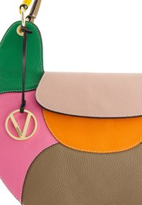 Multicolored leather handbag featuring green, pink, orange, brown, and beige panels. Includes a gold logo charm and stitched accents.