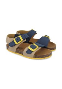 Sandalias azules y beige con dos correas ajustables, hebillas amarillas y una plantilla de corcho. Diseñadas con una suela de goma texturizada para ofrecer tracción.