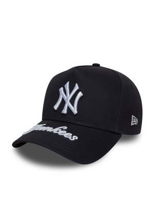 Black baseball cap made of fabric with a curved brim, featuring a white embroidered logo and "Yankees" stitching on the front.